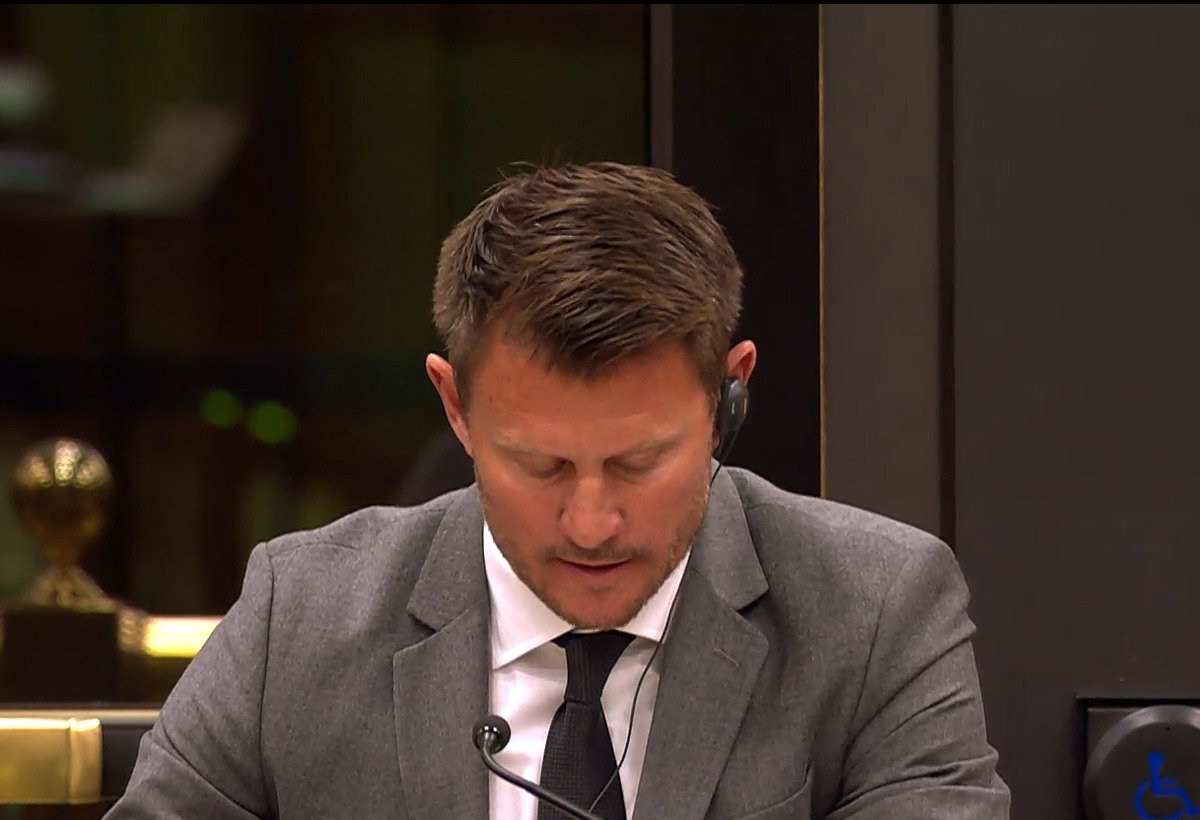 Kristian Firth looking down at the bar of the House of Commons